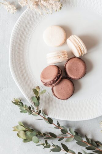20 Powerful Herbs for Financial Prosperity: How to Use Herbs to Attract Money 19 delicious macaroons on plate on white table