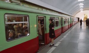 people in red and white train during daytime