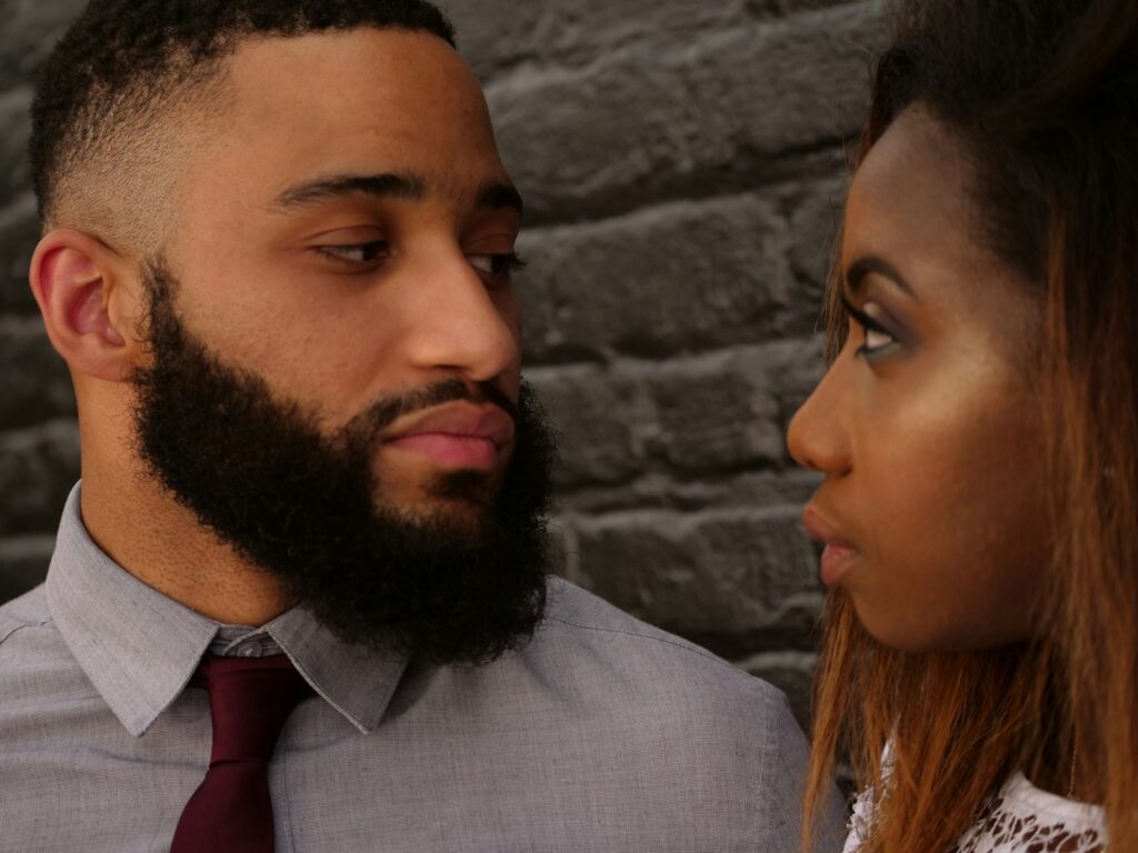 200+ Questions To Ask Your Boyfriend On Valentine's Day 8 man staring at woman near gray concrete wall